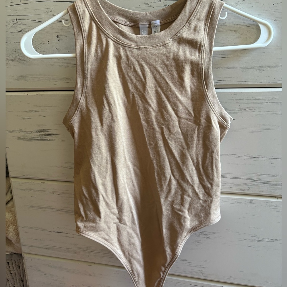 S/M tan bodysuit